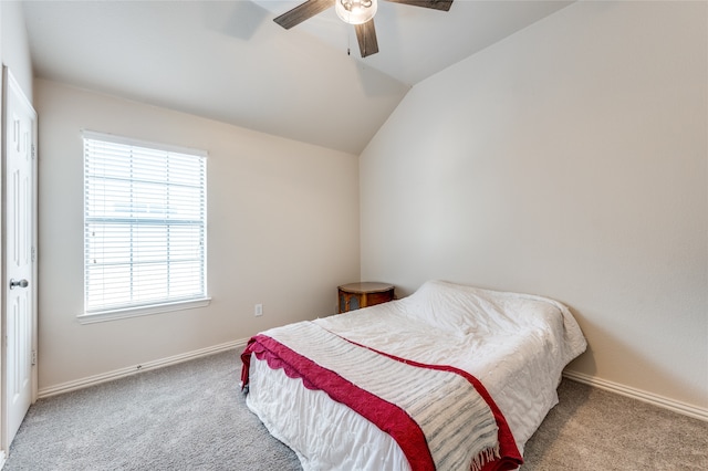 bedroom with carpet flooring, lofted ceiling, and ceiling fan