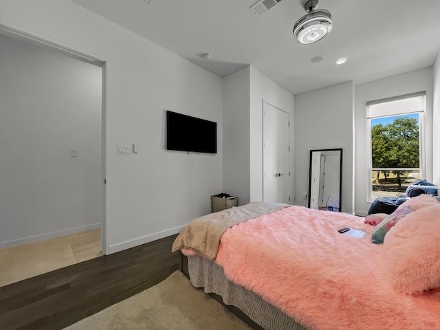 bedroom featuring wood-type flooring