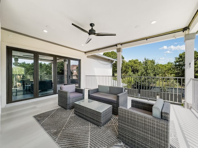 view of patio featuring a balcony, ceiling fan, and an outdoor hangout area