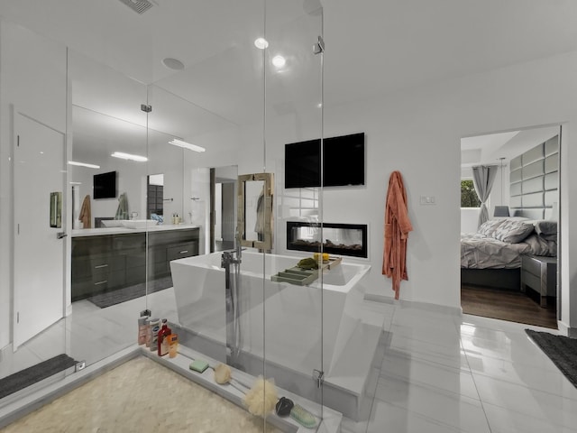 kitchen with light tile patterned flooring and a multi sided fireplace