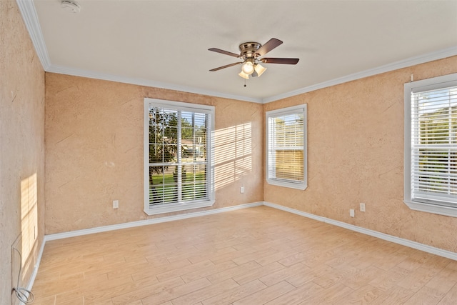 unfurnished room featuring ceiling fan, light hardwood / wood-style flooring, and ornamental molding