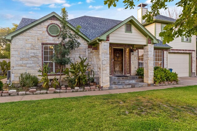 view of front of property featuring a garage, cooling unit, and a front yard