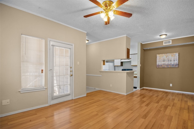 unfurnished living room featuring ceiling fan, crown molding, a textured ceiling, and light hardwood / wood-style floors