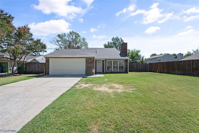 ranch-style home featuring a garage and a front lawn