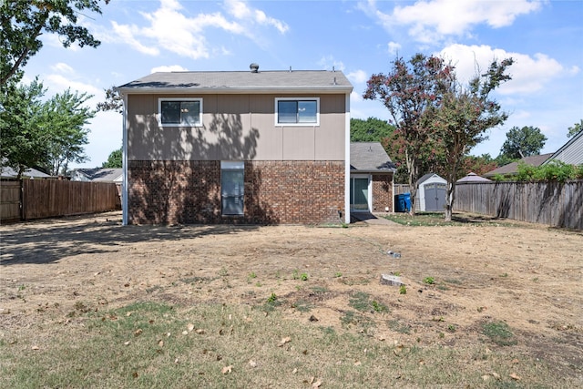 back of property featuring a storage unit