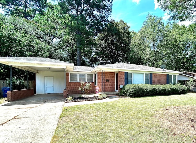 ranch-style house with a front yard and a carport