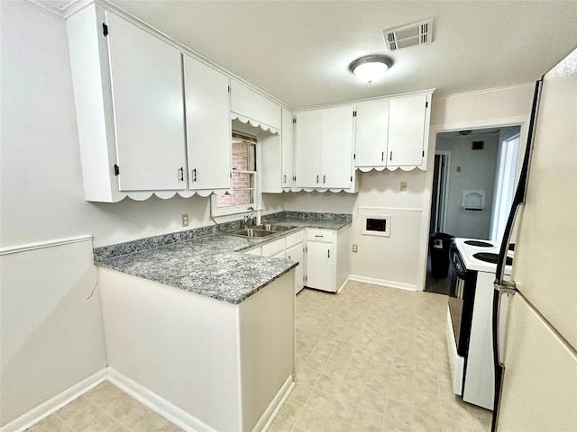 kitchen with light tile patterned flooring, sink, white appliances, and white cabinetry