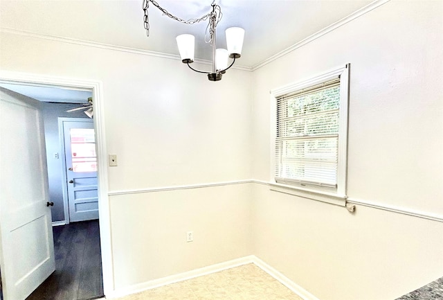 tiled empty room with ceiling fan with notable chandelier and crown molding