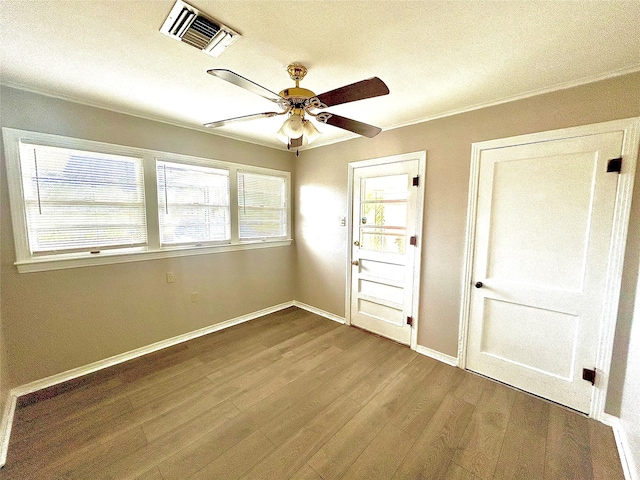 interior space with ceiling fan and hardwood / wood-style floors