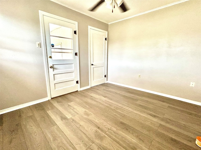 interior space featuring light hardwood / wood-style flooring, ceiling fan, and ornamental molding