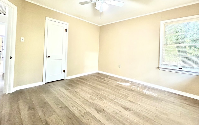 spare room with ceiling fan, hardwood / wood-style floors, and ornamental molding