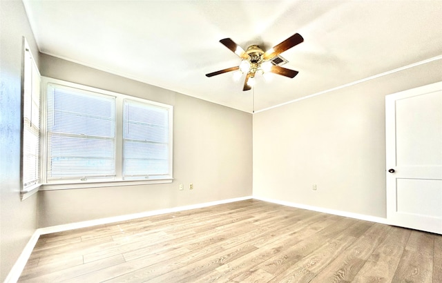 unfurnished room featuring ceiling fan, light hardwood / wood-style floors, and ornamental molding