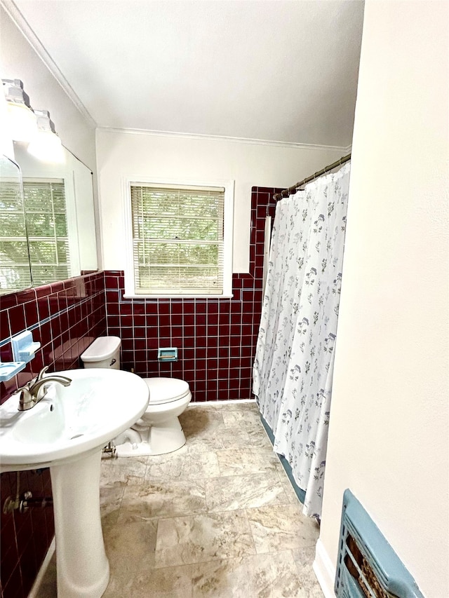 bathroom featuring decorative backsplash, tile patterned floors, tile walls, toilet, and walk in shower