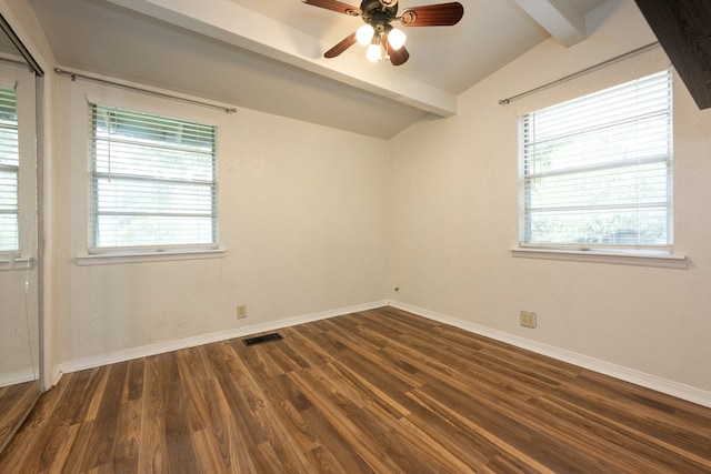 spare room with vaulted ceiling with beams, dark hardwood / wood-style floors, a healthy amount of sunlight, and ceiling fan