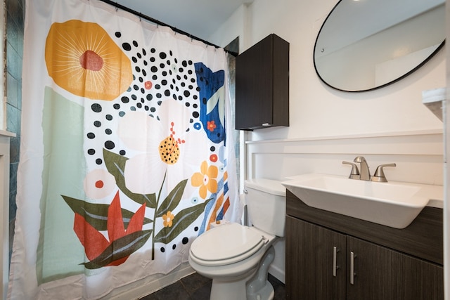 bathroom featuring vanity, toilet, tile patterned floors, and a shower with shower curtain