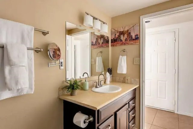 bathroom with tile patterned floors and vanity