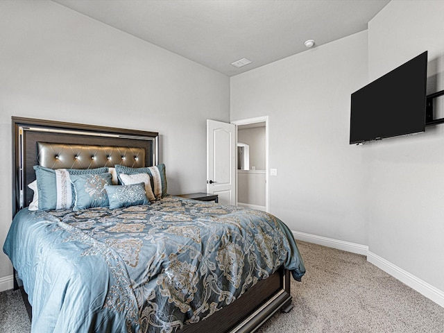 bedroom with carpet floors, visible vents, and baseboards