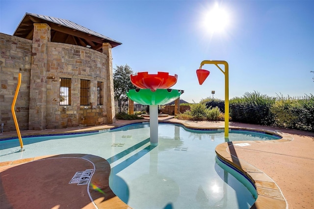 pool featuring a patio area