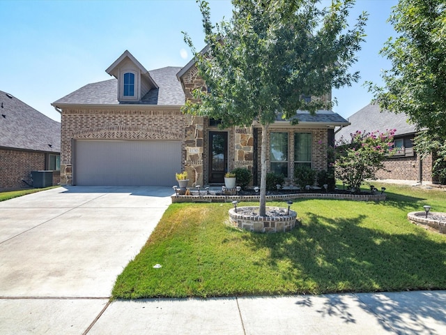 view of front of house with a garage, concrete driveway, a front lawn, and stone siding