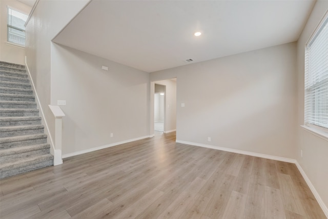 spare room with light wood-type flooring