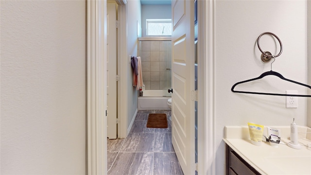 bathroom featuring tile patterned floors, vanity, and toilet