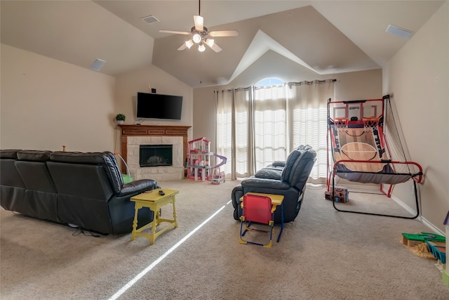 living room featuring lofted ceiling, carpet, a fireplace, and visible vents