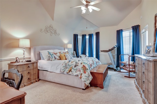 bedroom with ceiling fan, high vaulted ceiling, and light colored carpet