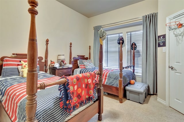 bedroom featuring carpet and baseboards