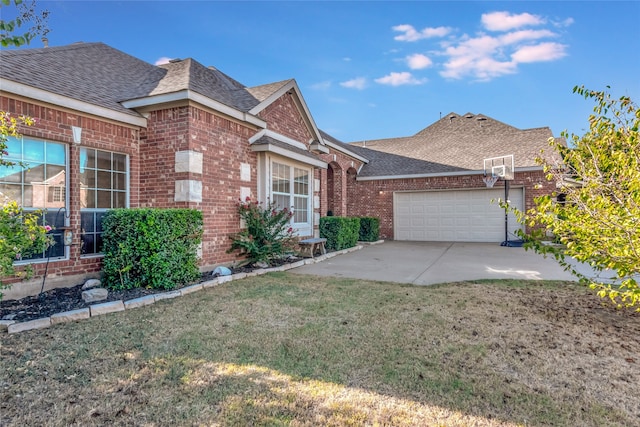 view of front of house featuring concrete driveway, brick siding, an attached garage, and a shingled roof