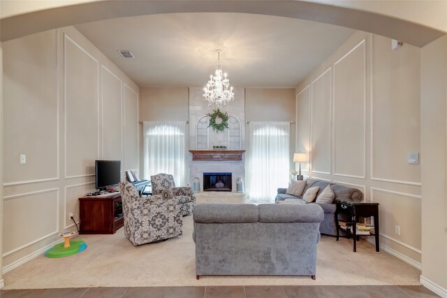 tiled living room featuring a chandelier