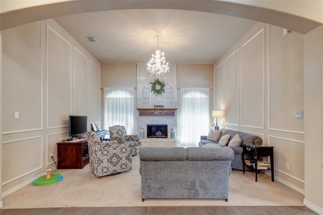 carpeted living room with tile patterned flooring, visible vents, and a decorative wall