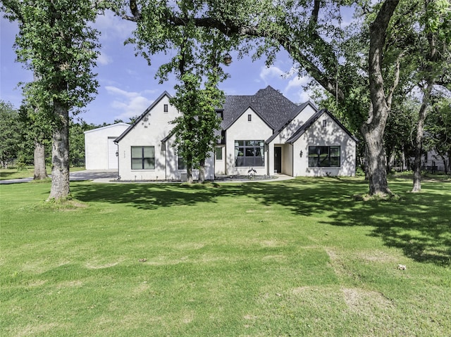 view of front of property with a front lawn