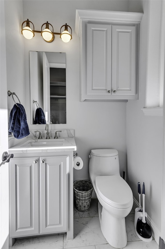 bathroom with tile patterned floors, vanity, and toilet