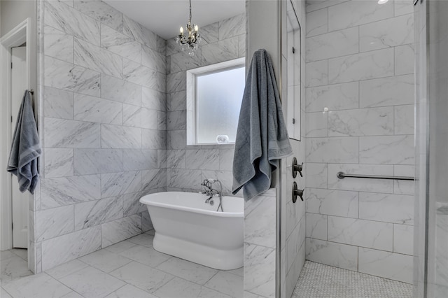 bathroom with plus walk in shower, tile walls, an inviting chandelier, and tile patterned floors