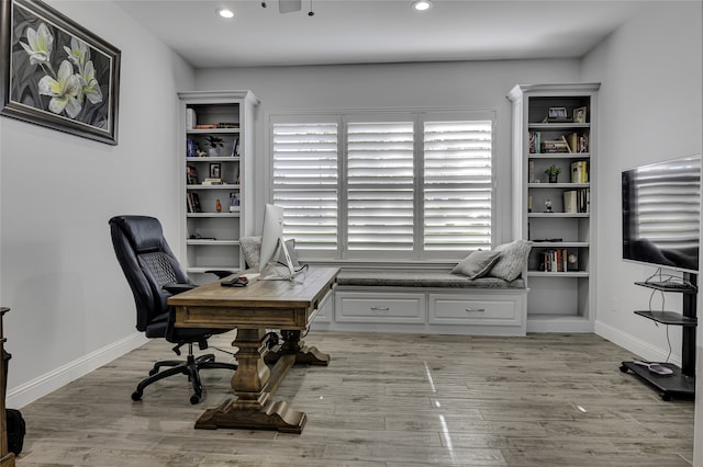 office with light hardwood / wood-style flooring