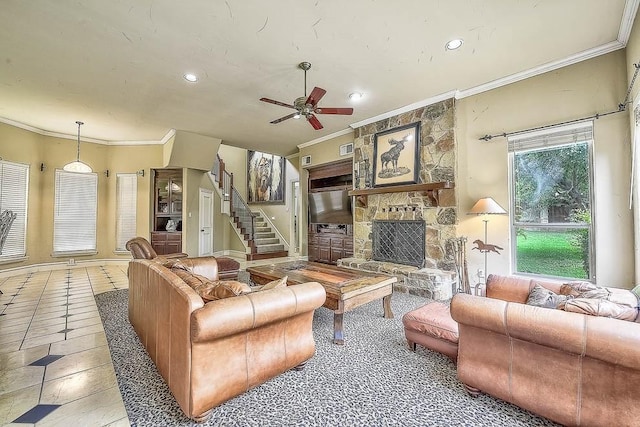 living room with recessed lighting, a fireplace, a ceiling fan, stairs, and ornamental molding