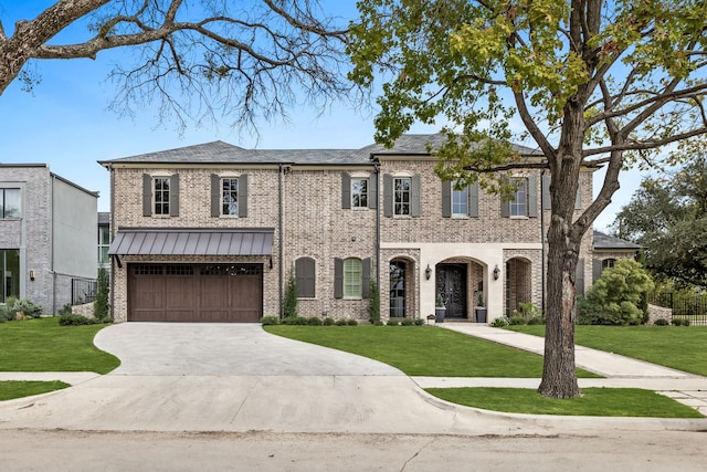 view of front facade with a garage and a front yard