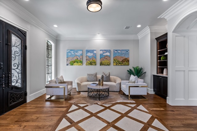 interior space featuring ornamental molding and dark hardwood / wood-style floors