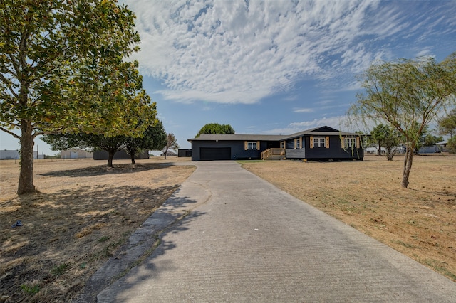 single story home featuring a garage