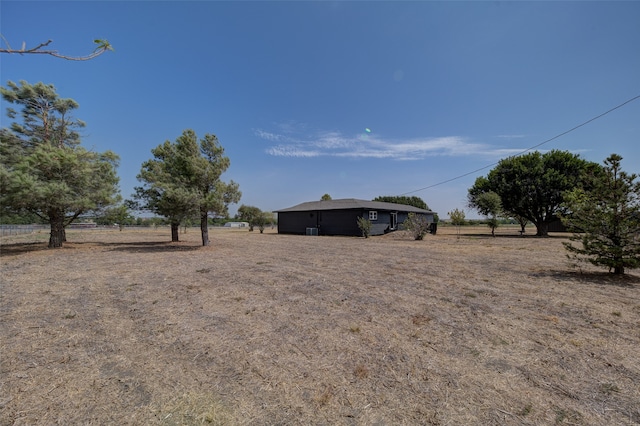 view of yard with a rural view