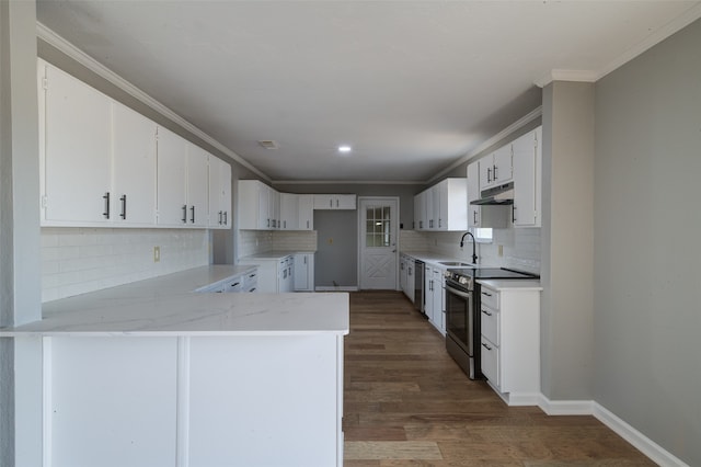 kitchen with backsplash, stainless steel appliances, dark wood-type flooring, and white cabinets