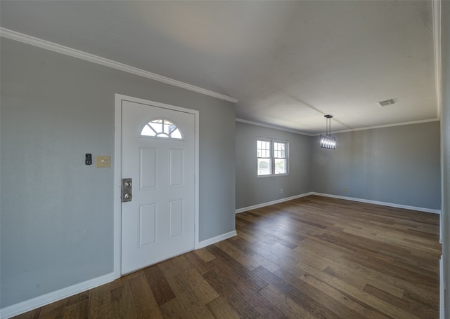 foyer featuring dark wood-type flooring and ornamental molding