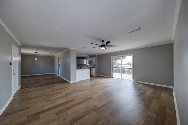 unfurnished living room with hardwood / wood-style floors, ornamental molding, and ceiling fan