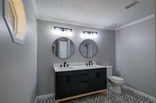 bathroom with toilet, crown molding, vanity, and tile patterned floors