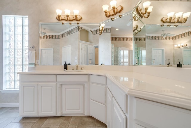 bathroom featuring walk in shower, vanity, and a wealth of natural light