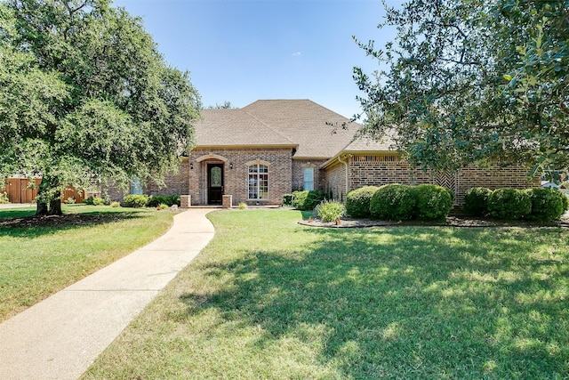 view of front of home with a front lawn