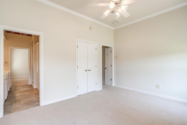 unfurnished bedroom with ceiling fan, light colored carpet, a closet, and crown molding