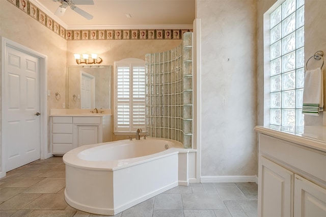 bathroom with plus walk in shower, ceiling fan, and vanity