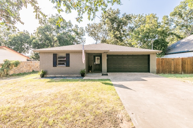 ranch-style house with a front yard and a garage