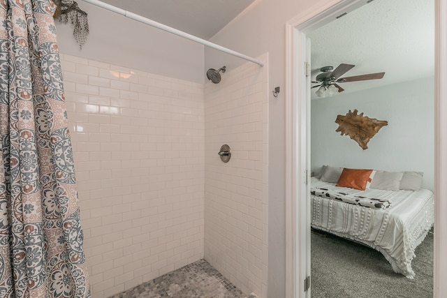 bathroom featuring ceiling fan and a shower with curtain